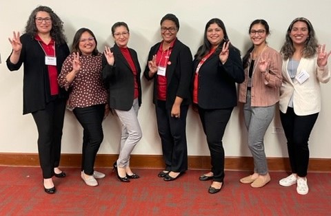 From left to right, Maria Honey, Judith Corral, Esmeralda Luna, Hope Pacheco, Esmeralda Valdez, Stephanie Perez-Gil, and Dr. Raven Jones at the Good Trouble: Ally Ship in Action Conference. From left to right, Maria Honey, Judith Corral, Esmeralda Luna, Hope Pacheco, Esmeralda Valdez, Stephanie Perez-Gil, and Dr. Raven Jones at the Good Trouble: Ally Ship in Action Conference.