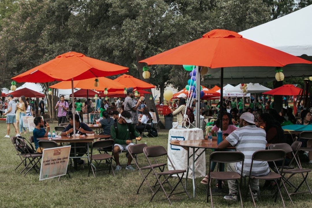 Tables with people eating.