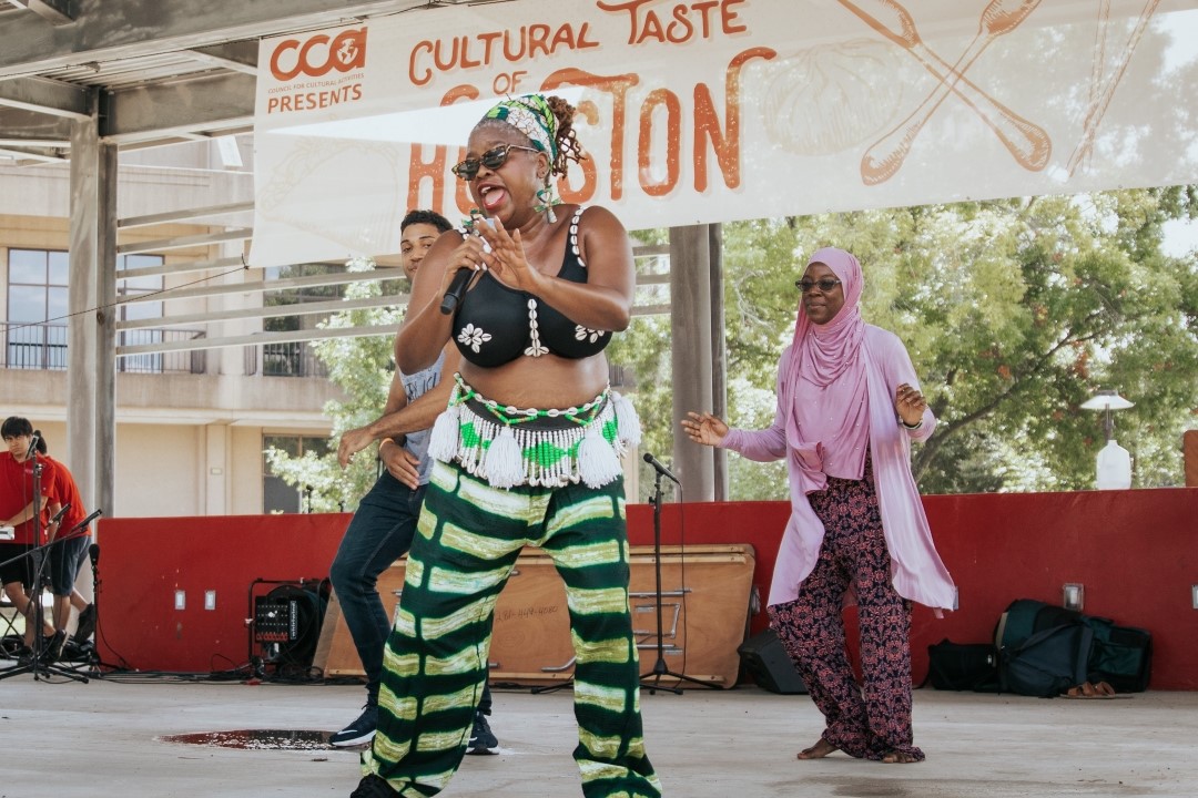 Performers dancing on stage.