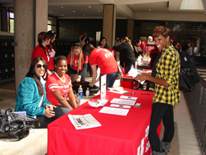 Political Science senior Frances Paris visits the Communication Science and Disorders information booth