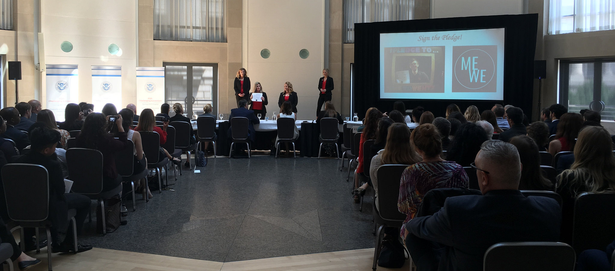 Me to We team presenting their project to senior leaders, policymakers, and guests from DHS, Facebook, and other organizations in Washington, D.C. as part of the global Peer to Peer – Challenging Extremism initiative,