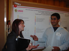 JJorge Banda interacts with an interested conference participant.