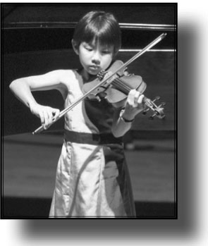 Little girl playing the violin