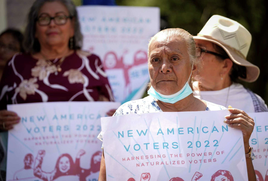 Women holding a sign