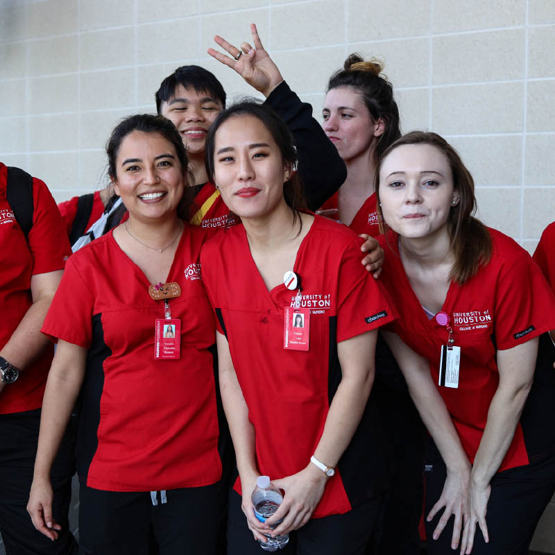 Group photograph of nursing students close together while smiling.