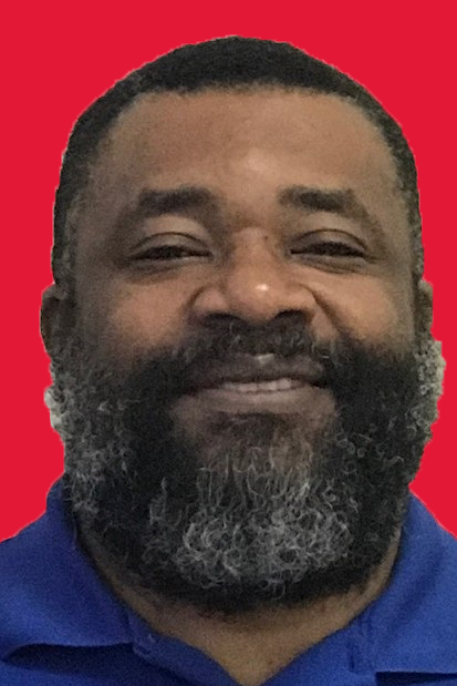 Portrait of a Black man with a bread smiling