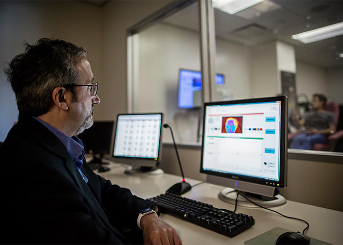 Ioannis Pavlidis, a computer science professor at the University of Houston, measures a test subject's perinasal perspiration in his Computational Physiology Lab.