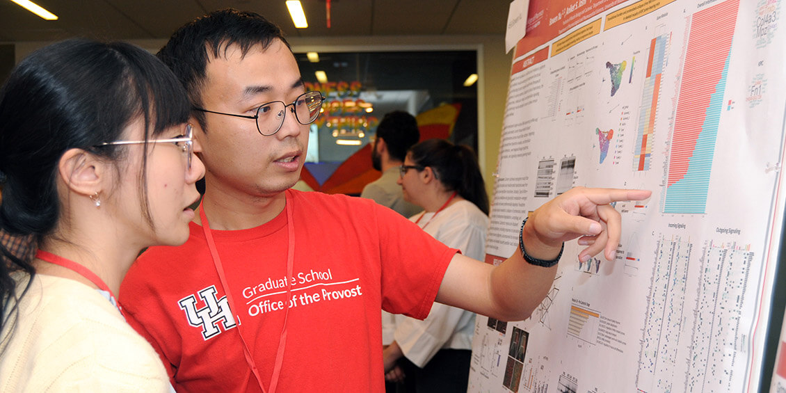 student presenting poster