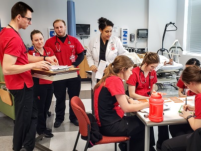 Nursing students in a simulation lab with an instructor