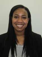 Portrait of an African American woman with long black hair smiling